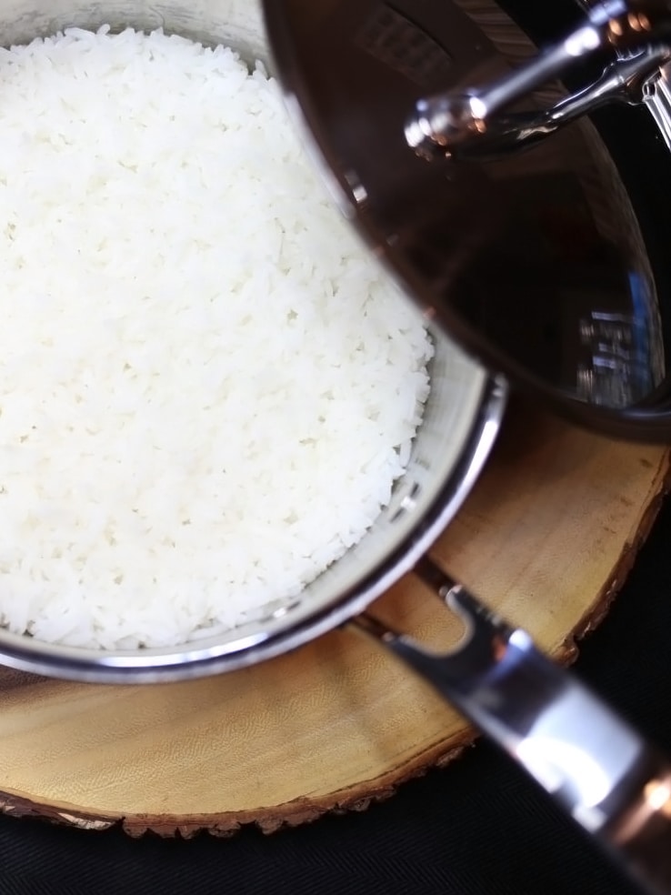 Overhead view of a pan of cooked white rice