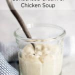 Clear jar of condensed cream of chicken soup with a spoon
