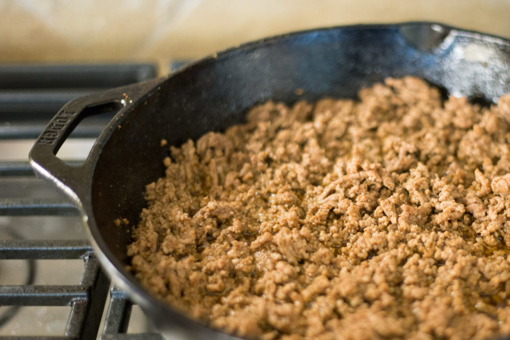 Cast iron skillet with browned ground beef