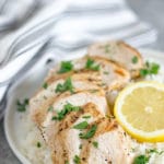 Plate of chicken and rice with lemon and herbs