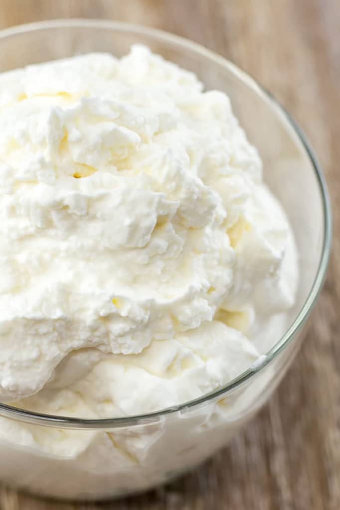 A clear bowl of whipped cream