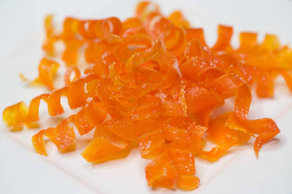 A White plate of candied carrot curls