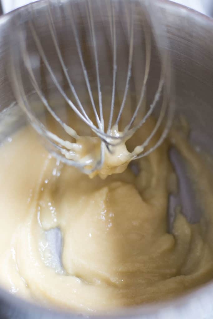 A bowl of roux with a whisk