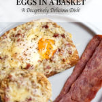 A piece of bread with a sunny side up egg in the center, bacon, and a bowl of fresh eggs