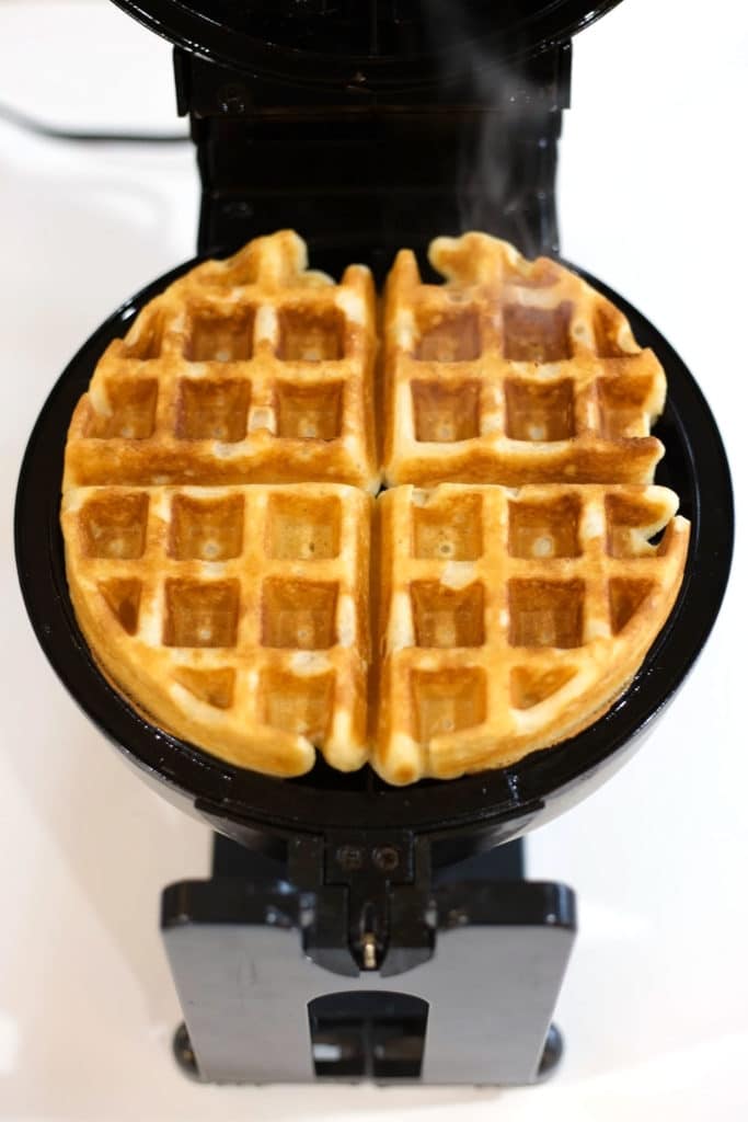 Cooked waffle in open waffle iron