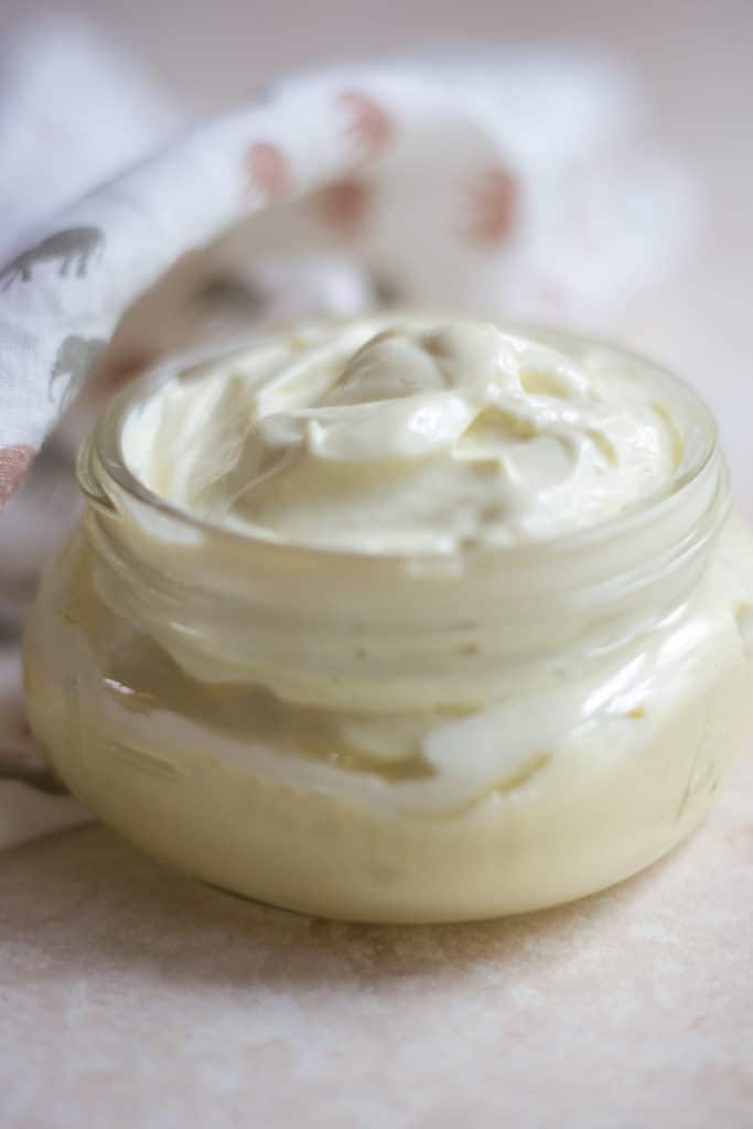 A clear jar of homemade mayonnaise