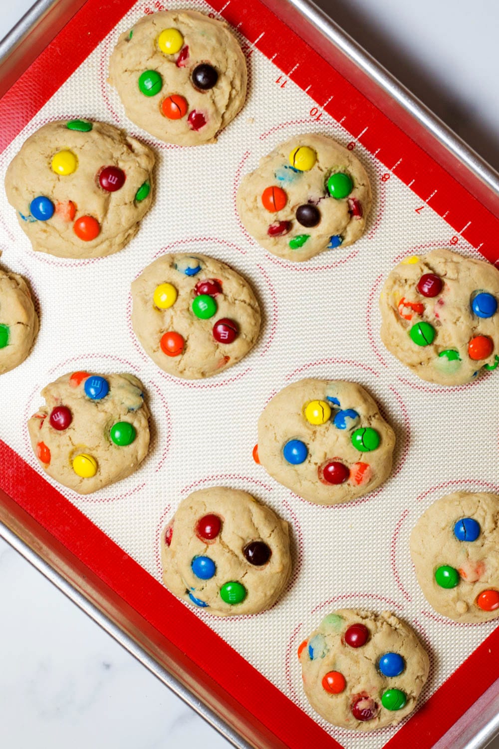 A baking sheet topped with M&M Cookies