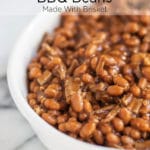 A white baking dish with bbq beans