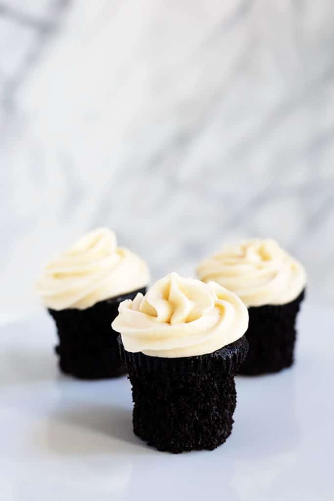 Plate of dark chocolate cupcakes with salted caramel frosting