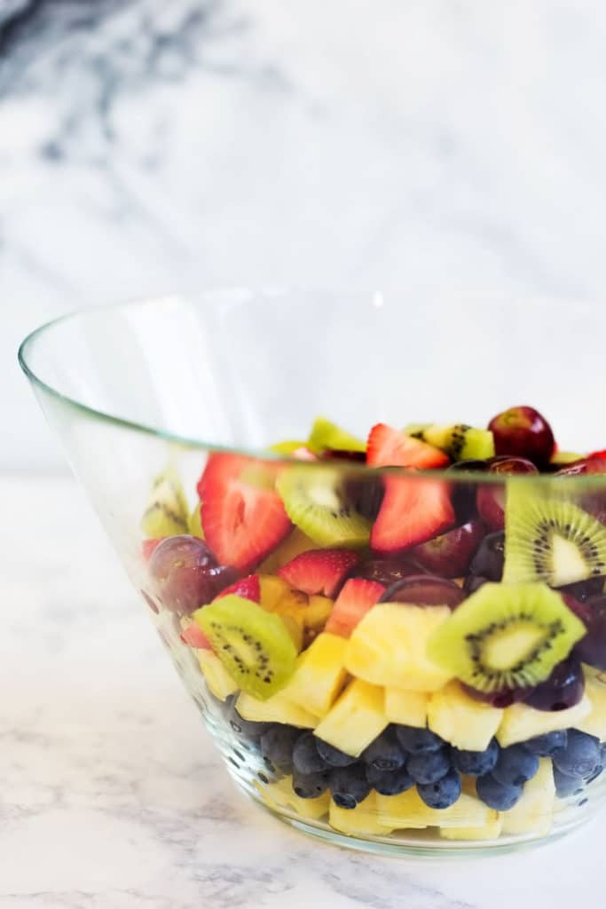 Clear bowl with layers of fresh fruit