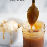 A spoon dripping caramel sauce into a clear jar and a white bowl of vanilla ice cream drizzled with caramel sauce