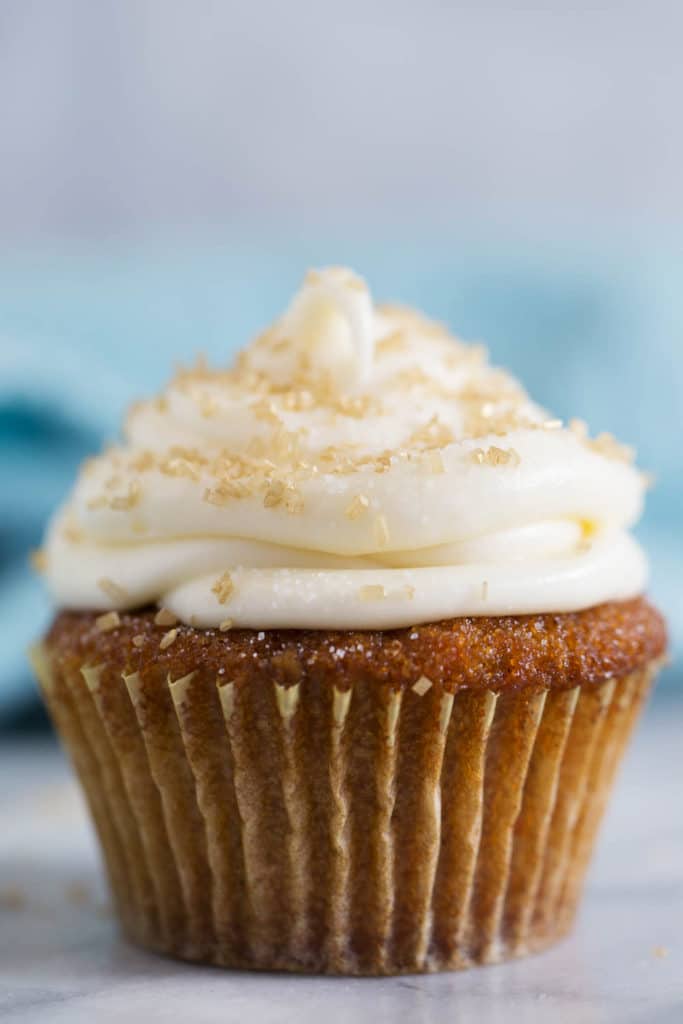A carrot cake cupcake with cream cheese frosting