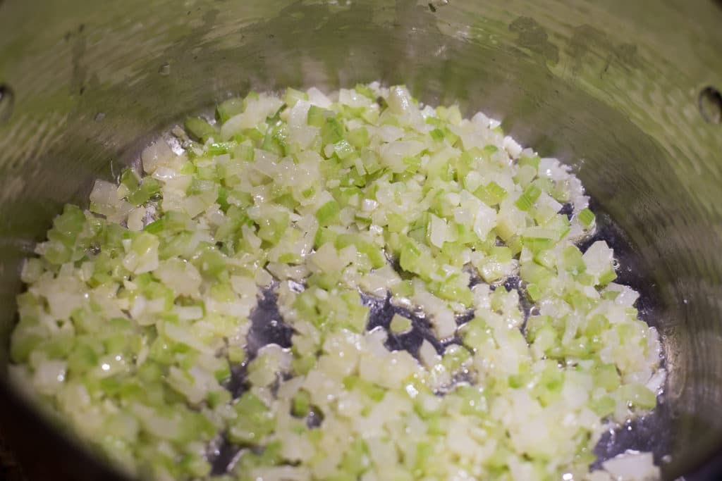 Sauteed celery and onions in a pan